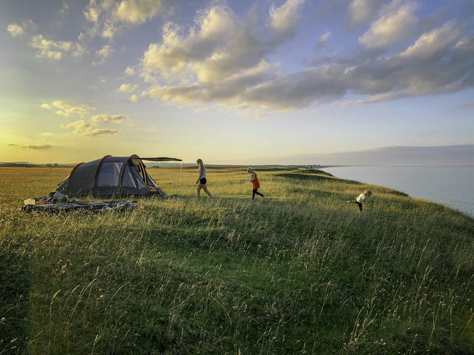 Golden-hour gathering on a grassy overlook